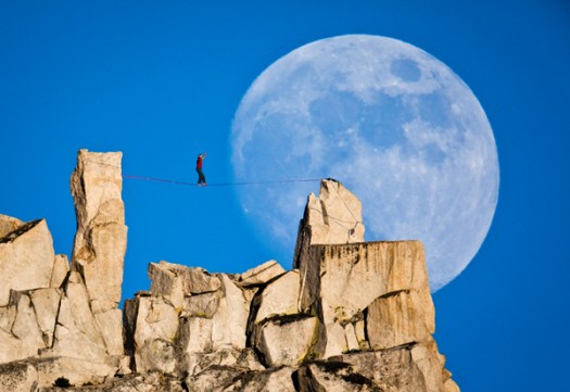 Dean Potter slacklines against a full moon in